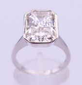 A 9 ct white gold and diamond solitaire ring. The stone spreading to approximately 3.5 carats.