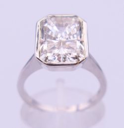 A 9 ct white gold and diamond solitaire ring. The stone spreading to approximately 3.5 carats.