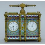A cloisonne carriage clock/barometer. 12.5 cm wide.