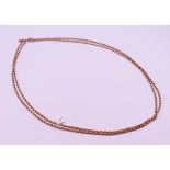 A 9 ct gold guard chain. 154 cm long. 32.4 grammes.