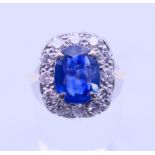 An 18 ct gold, sapphire and diamond ring, the sapphire spreading to approximately 3 carats.