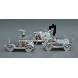 A silver-plated car-form tea set. The teapot 25 cm long.