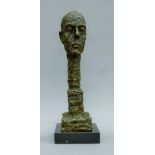 After Giacometti, abstract bronze head on a marble plinth base. 38.5 cm high.