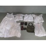 Collection of purses and baby/infant gowns; incl. mid 20th century handbag and two purses with match