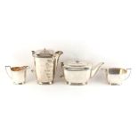 Property of a lady - an Art Deco silver four piece tea set, the teapot & hot water jug handles &