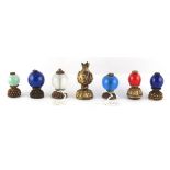 Property of a gentleman - a collection of seven Chinese gilt metal hat finials, Qing Dynasty, second