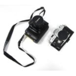 Two Canon SLR Cameras: Canon T90 with Canon FD 1:2.8/28mm lens and Canon FTb QL 35mm film camera