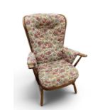 Ercol Medium Colour Wood Easy Chair with spindle back, 'H' stretcher to splayed legs, 102cm high.