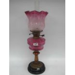 Veritas Oil Lamp with Black Glazed Terracota Base, brass support to cranberry glass well,