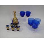 Overlaid Blue Glass Liqueur Decanter and Five Tots, three Murano blue drinking glasses, two taller:-