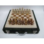 Vintage carved onyx/stone chess set, comprising hand-crafted chequered game board and complete set
