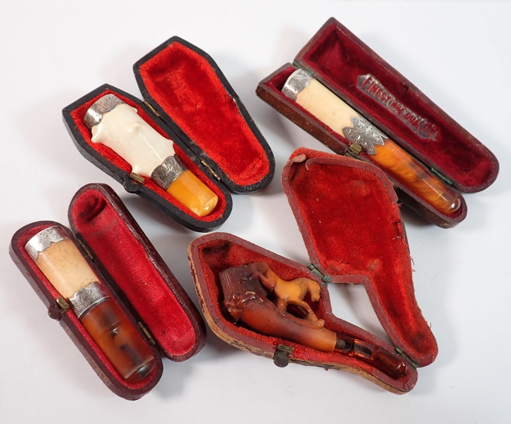 A collection of ten antique and vintage meerschaum and amber pipes plus ...