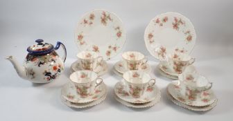 An early 20th century Grafton tea service with floral decoration comprising six cups and saucers,