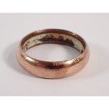 A yellow metal cased gentleman's wedding ring, (with metal core & composition filling to interior)