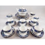 A Wedgwood Blue Siam tea and dinner service comprising teapot, six cups and saucers, six tea plates,