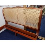 A French style large double bed frame with canework and carving by 'And so to Bed' no mattress,