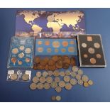 A group of coin sets and coins to include Royal Mint The Millennium Crown five pound coin in sleeve,