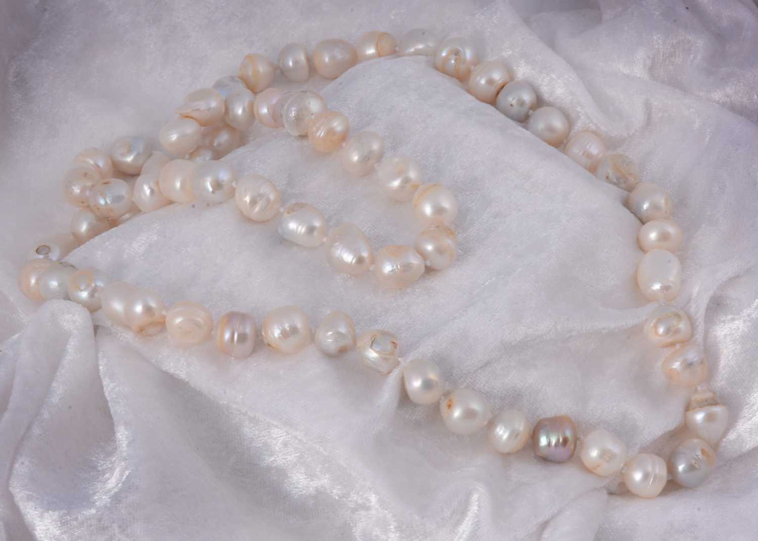 A large string of baroque pearls, knotted strung, 41 cm together 141g