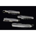 A group of four Multi-Tools/pocket knives,