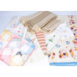 A very large collection of vintage table linen and fabrics