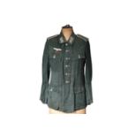 A WWII German Army green herringbone twill Tunic,