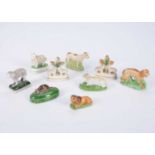 A pair of Staffordshire miniature sheep,