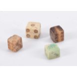 Four ancient bone dice,