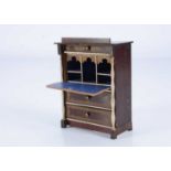An 19th century Waltershausen larger scale dolls’ house drop front bureau,
