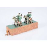 An early 20th century Erzgebirge cavalry wooden crank toy,