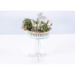 An early 20th century German painted tinplate dolls’ house plant stand,