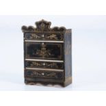 A late 19th century Waltershausen ebonised dolls’ house drop front bureau,