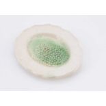 A rare late 18th century doll’s or large scale dolls’ house creamware plate of peas,