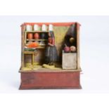 A mid 19th century Thüringen composition and wood kitchen mechanical toy,