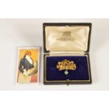 A Regency era gold and gemset acrostic "PEACE" brooch from Watier's Fête of 1814,