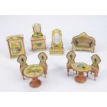 A late 19th century German chromolithographic paper covered dolls’ house set with insects,