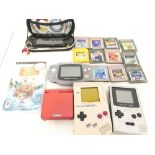 A Collection of Nintendo Game Boys And A Sony PSP.