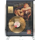 A framed and glazed Marilyn Monroe Never Before And Never Again gold disc with COA.