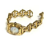 A vintage ladies gucci watch with a mother of Pearl style dial.