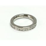 A platinum channel set full eternity ring. Contain