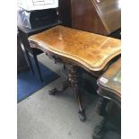 A Victorian walnut card table. Dimensions 75cm tal