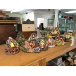A collection of Disney snowglobes including winnie
