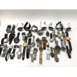 A large collection of assorted fashion watches including Rado, Rotary etc