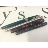 Four vintage pens with gold nibs . Parker , Burnham , Sheaffer