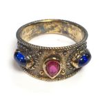 a sterling silver ring set central rubylike, size O