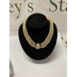 Christian Dior triple strand dress pearl choker necklace.