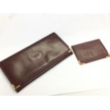 A Cartier Paris leather wallet and card case. 90Cm long