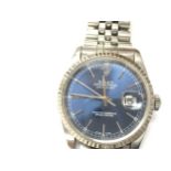 Rolex Datejust 16234 features a vibrant blue dial with Roman numerals. Box and papers. Seen running.