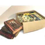 A box of books 1963-64 with dust covers including Ian Fleming You Only Live Twice, On Her Majesty'