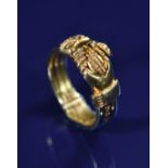 A 19thC Fede Gimmel ring comprising three rings joined by a tiny pin, allowing them to pull apart to