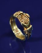 A 19thC Fede Gimmel ring comprising three rings joined by a tiny pin, allowing them to pull apart to